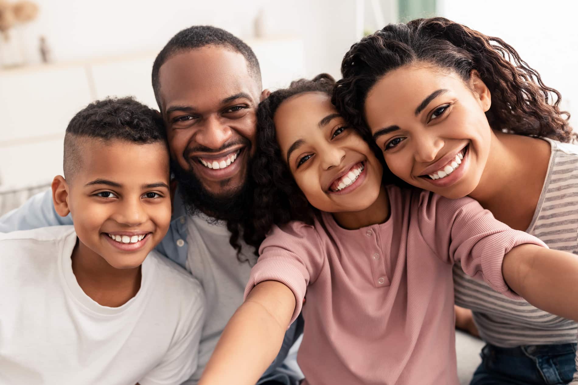 AdobeStock_427048913 v2 family smiling after a same day dental appointment in Lindenhurst IL
