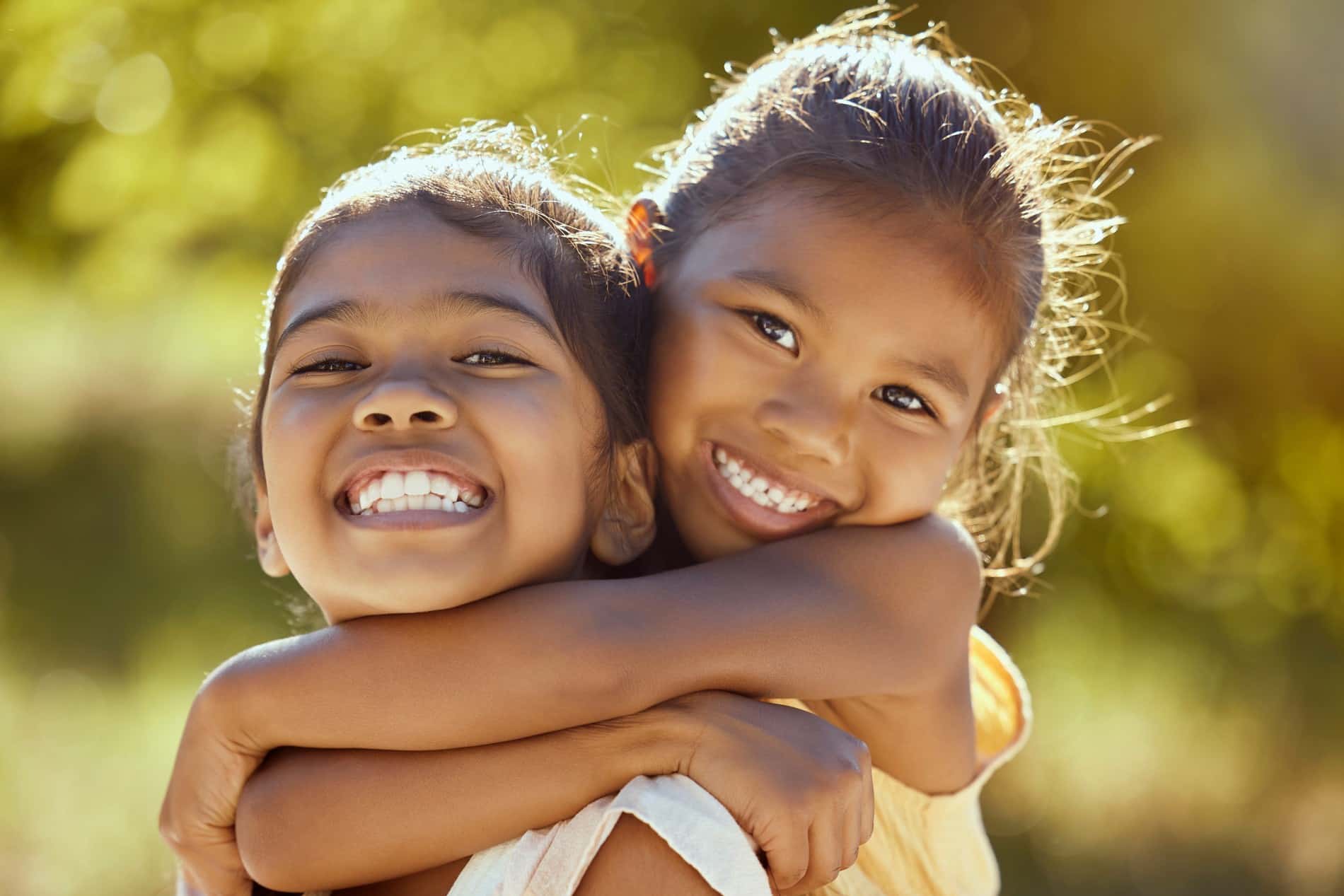 AdobeStock_542636628 v2 Girls with health teeth after pediatric dentistry with Dr. Chung